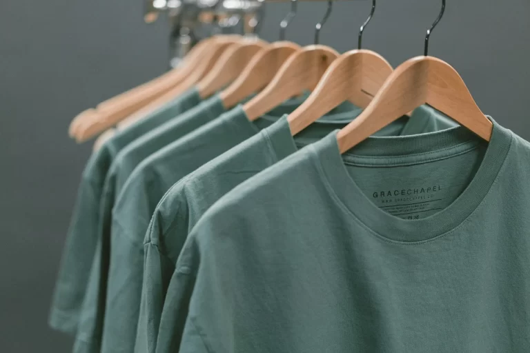 Green shorts hanging on a rack. Update Prices in WooCommerce