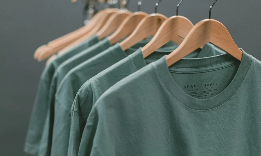 Green shorts hanging on a rack. Update Prices in WooCommerce